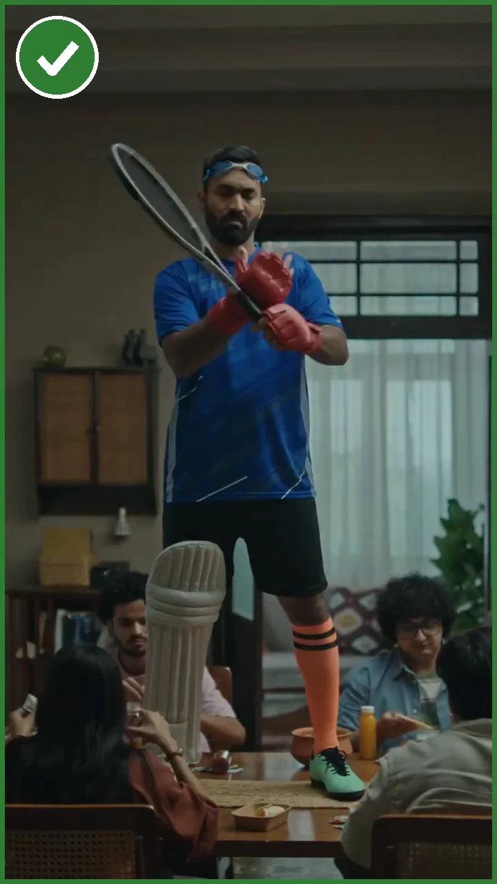 Swiggy: Opens on a man in cricket pads swinging a tennis racket at the dinner table.